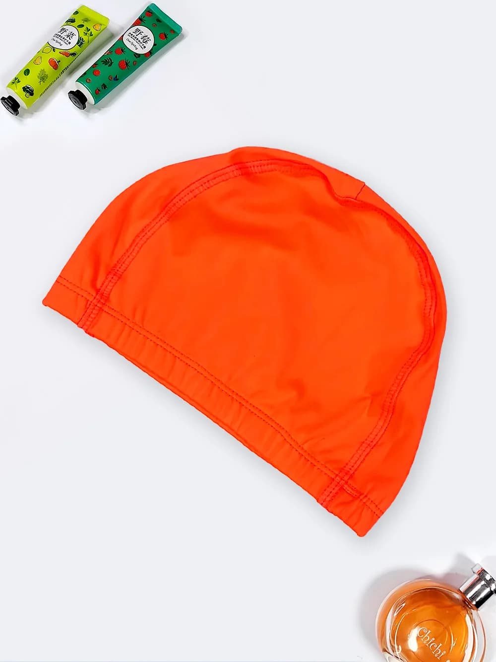 کلاه استخر زنانه و دخترانه بچگانه به رنگ نارنجی با جنس پارچه ای ضد کلر اعلا