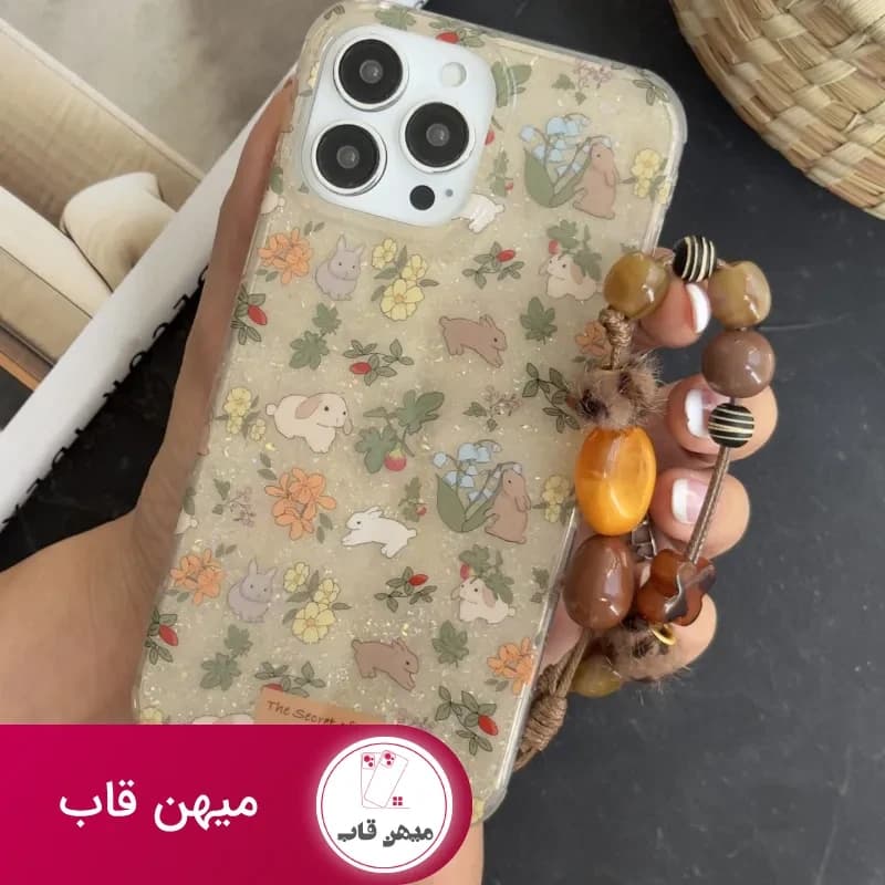 قاب موبایل آیفون خرگوش باغ جادویی + بندست مخملی - کد (۱۲۱۳۵۵)
