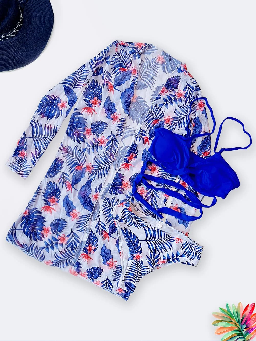 مایو سه تیکه زنانه بصورت ست مایو و بیکینی و رومایویی زنانه آبی و سفید رنگ طرح هاوایی