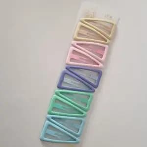 گیره تق تقی مثلثی رنگی