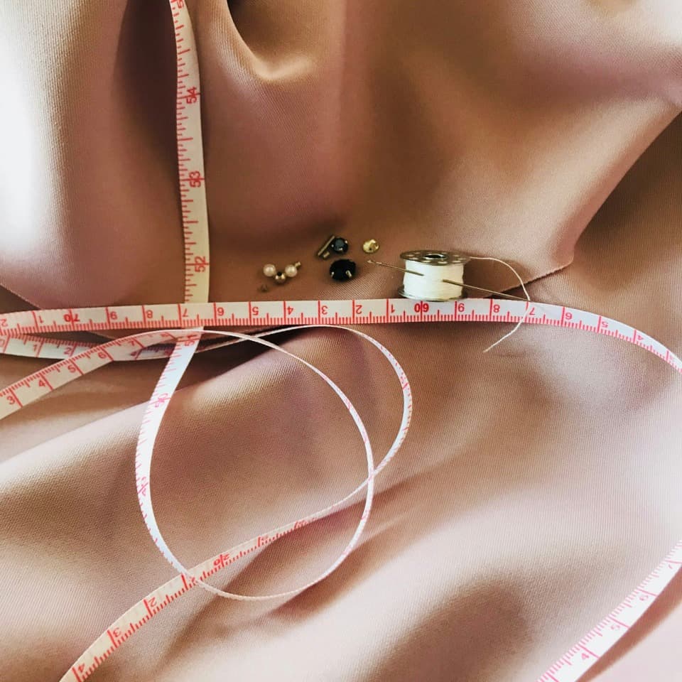 لوگوی فروشگاه پارچه سرای باقری فرد