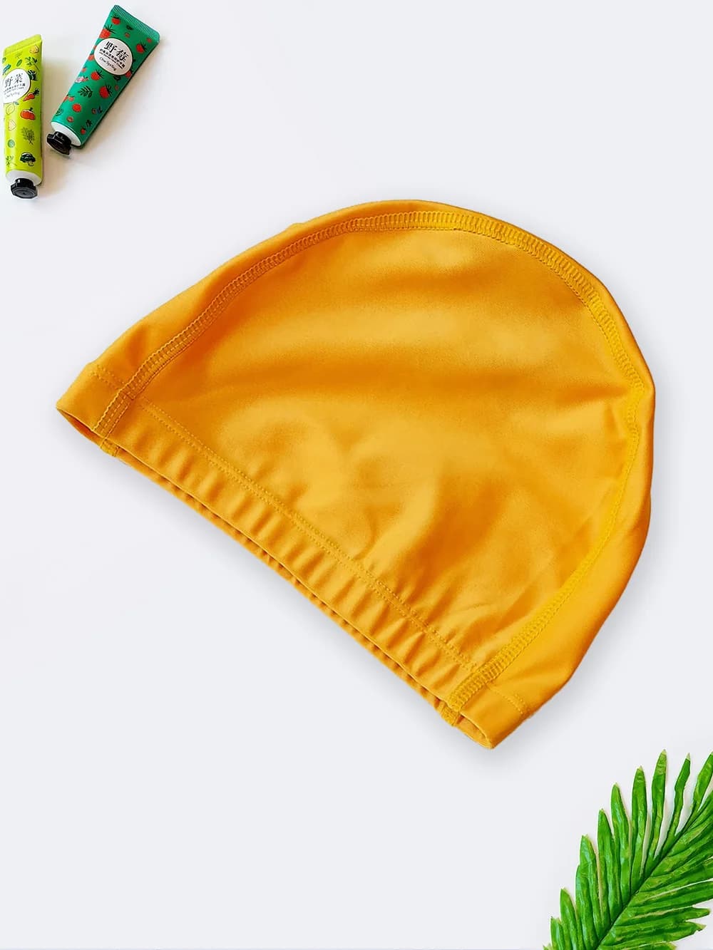 کلاه شنا زنانه زرد رنگ شیک با جنس پارچه مایویی زنانه و دخترانه ضد کلر با کیفیت