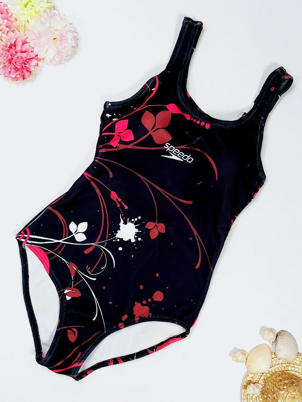 مایو زنانه پشت قهرمانی اسلیپ مشکی رنگ زنانه طرح گل اسپیدو ( Speedo ) کاپدار