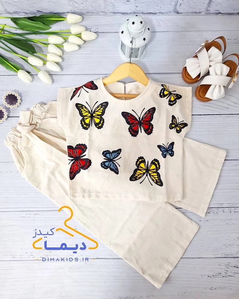 ست کراپ و شلوار دخترانه لینن کرم طرح پروانه های رنگی