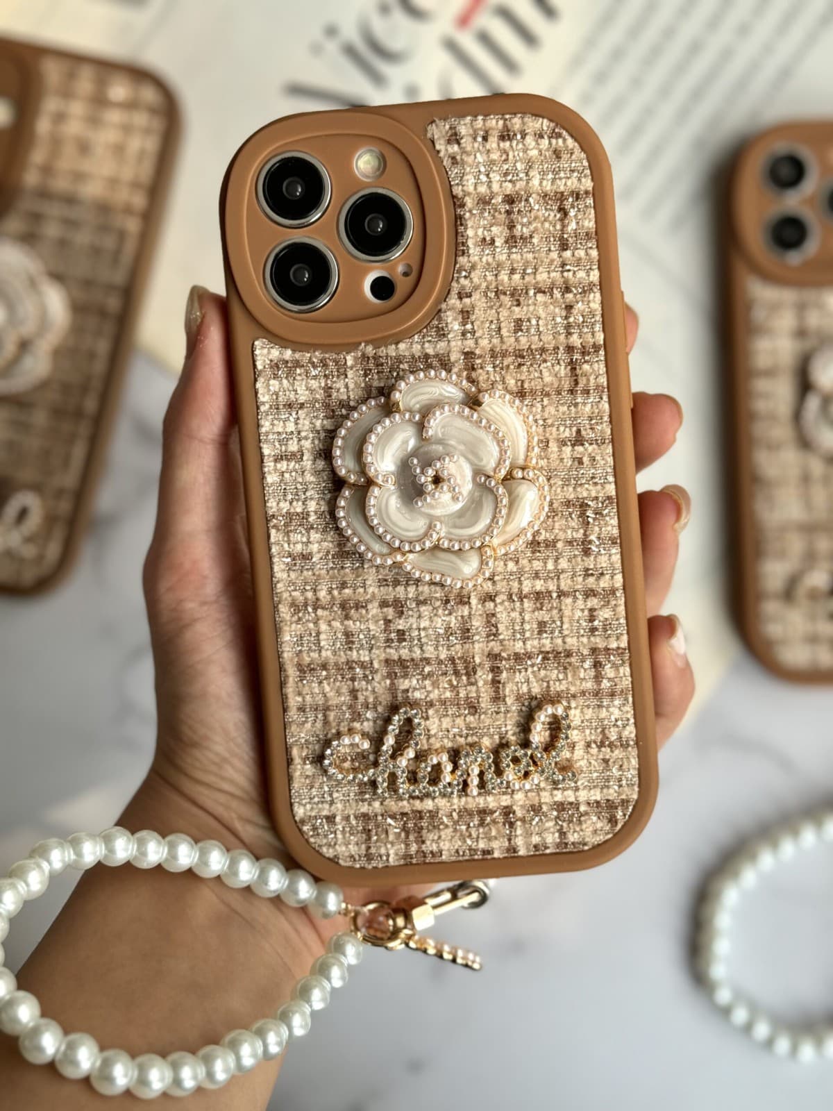 قاب موبایل آیفون شنل گل حصیری بند مرواریدی - کد (۹۵۳۳۶)